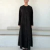 Black Abaya with Curved Ornamental Motif in Washed slub jacquard - main view | JAAZLINE JZA26-22